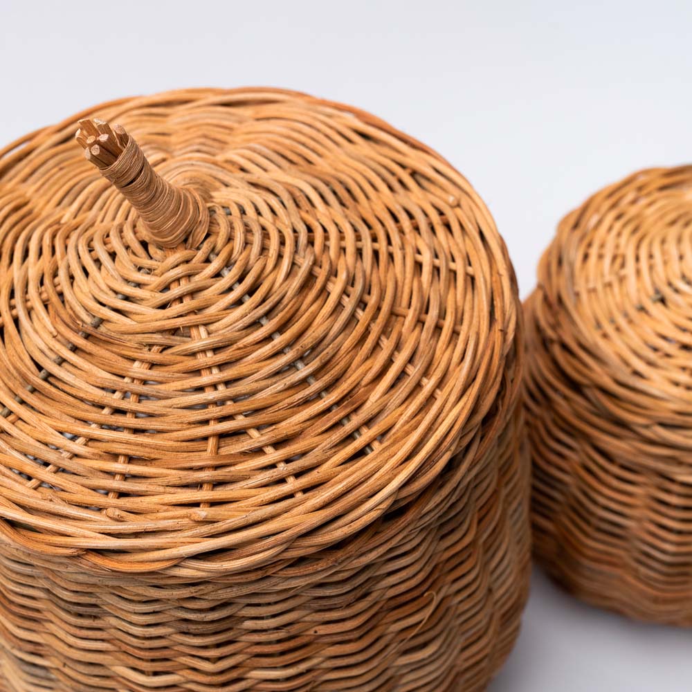 Close up of line feature on natural wicker basket with lid on a white background