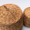 Close up of line feature on natural wicker basket with lid on a white background 