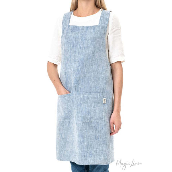 Model wearing Cross-Back Linen Apron in Blue Melange