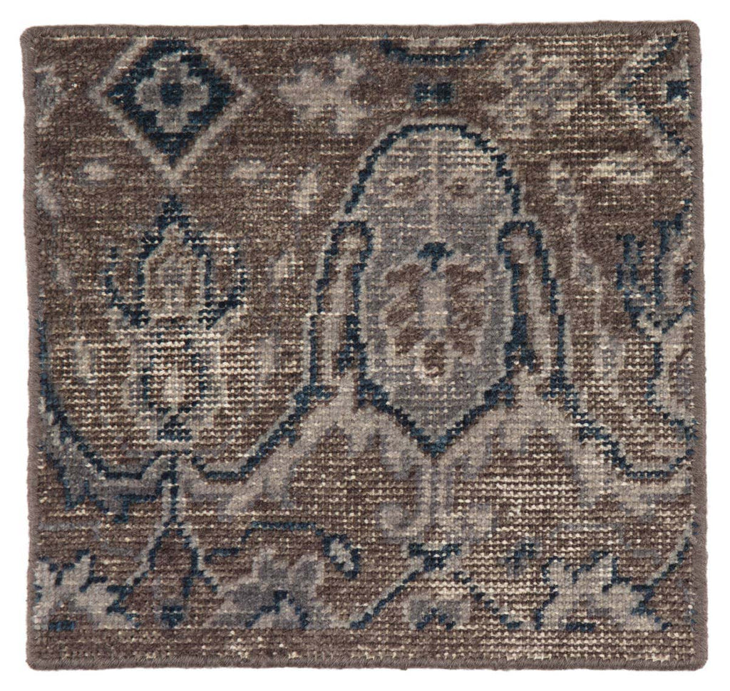 Close up of Jaipur living REVOLUTION - REL06 rug with light brown background and blue baroque inspired pattern on a white background