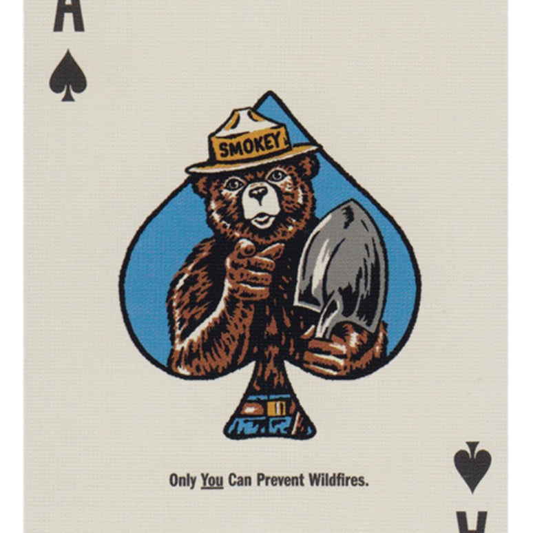 Art of Play brand Smokey Bear green and white playing card with smokey bear image on a white background