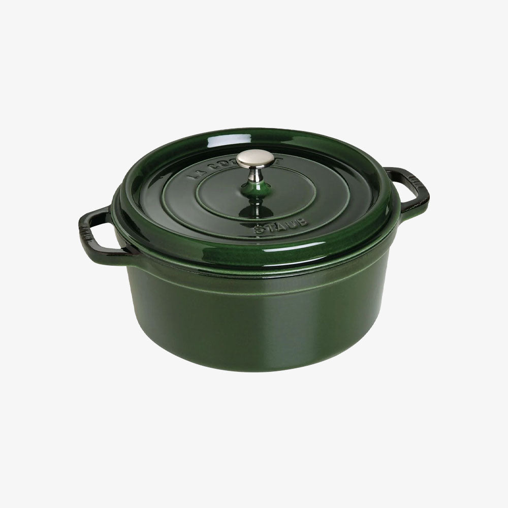 Staub 7 Quart Round Cocotte in Basil Green on a white background