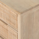 Six drawer 'Sydney' dresser with cane drawer fronts and mango wood pulls with natural mango wood exterior by Four Hands Furniture on a white background