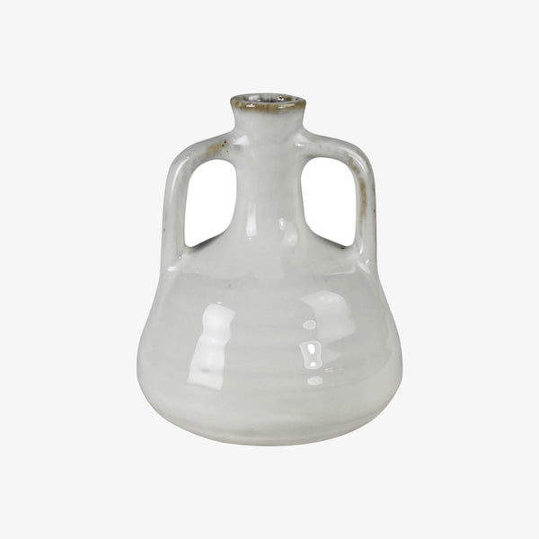 White ceramic vase with curved handles on a white background