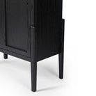 Four hands furniture brand Tolle panel door black cabinet with arched top and wood stained interior on a white background