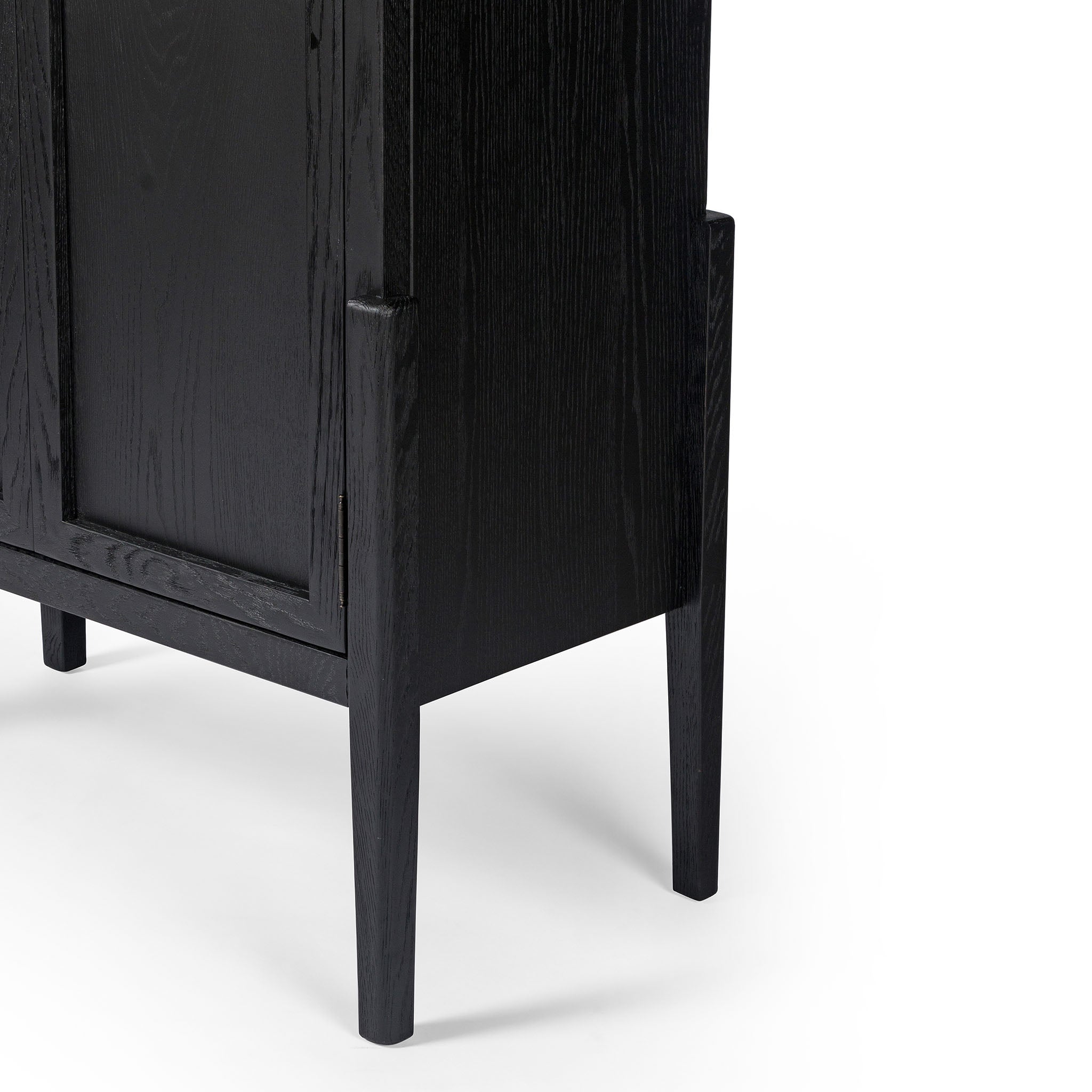 Four hands furniture brand Tolle panel door black cabinet with arched top and wood stained interior on a white background