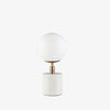 Surya brand Una table lamp with white marble base and white globe on a white background