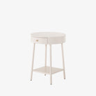 White round 'van' side table with shelf and drawer  by four hands furniture on a white background