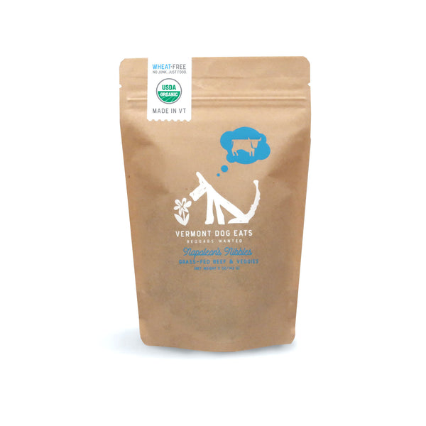 Vermont Dog Eats Napoleon's Nibbles craft colored bag of dog treats on a white background