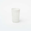 Single  hand carved white tea glass on a white background