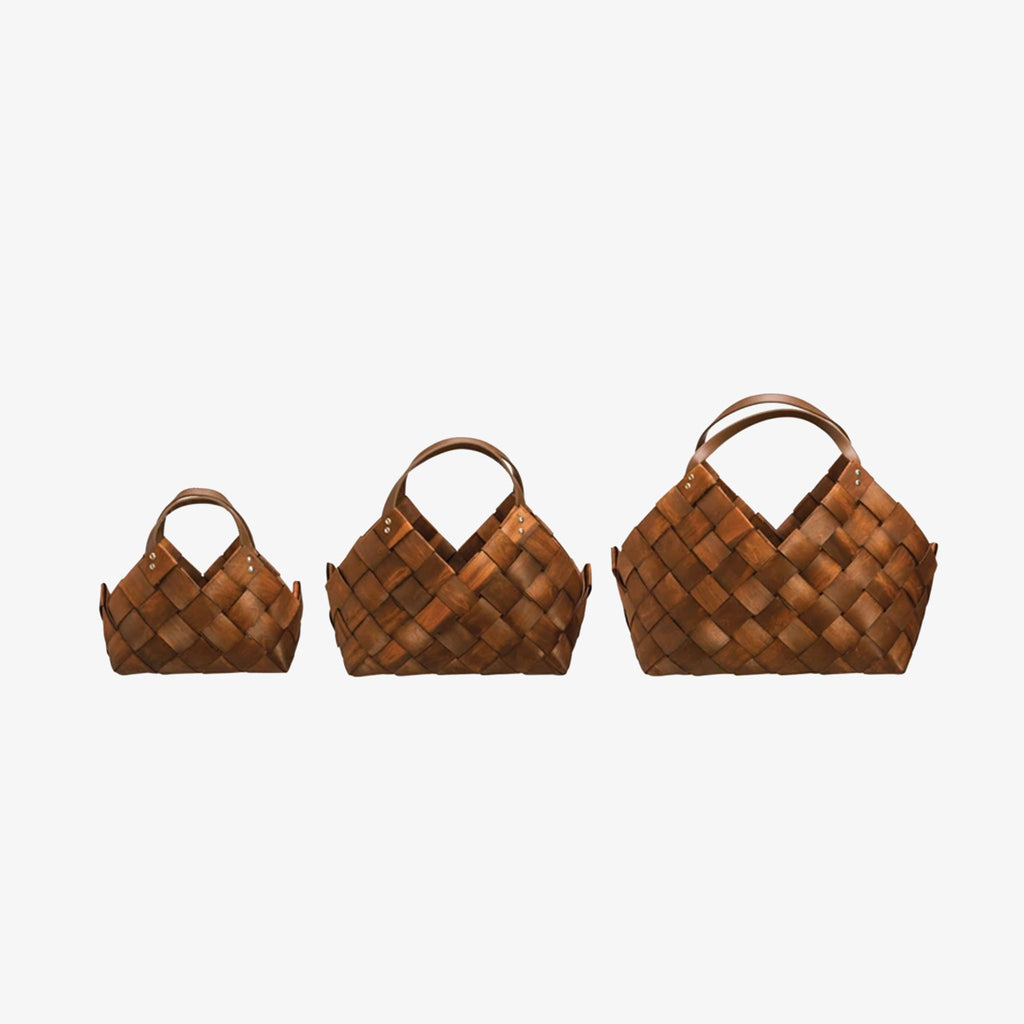 Three Seagrass Baskets with Leather Handles on a white background