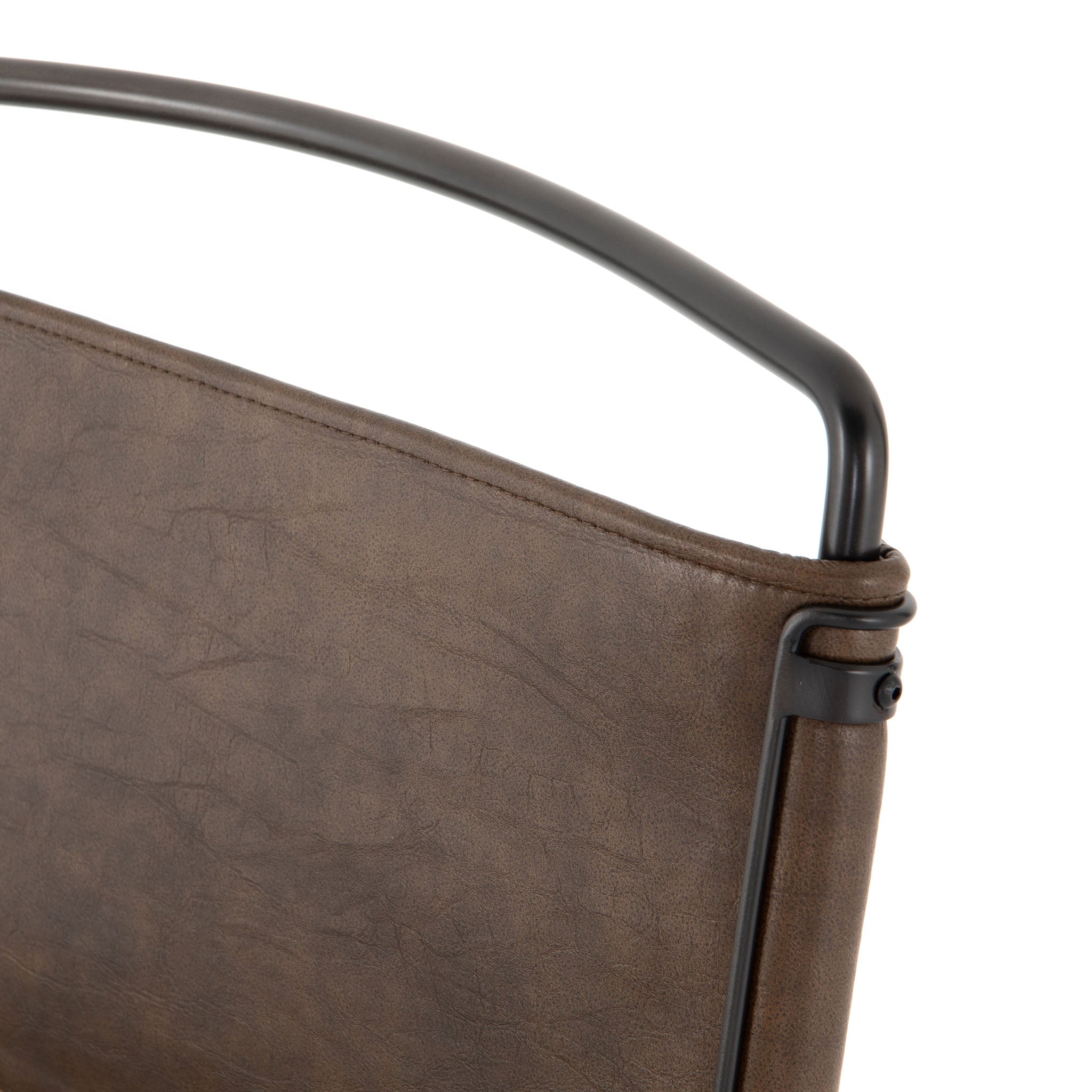 Four hands brand wharton chair with black iron frame and dark brown leather seat on a white background