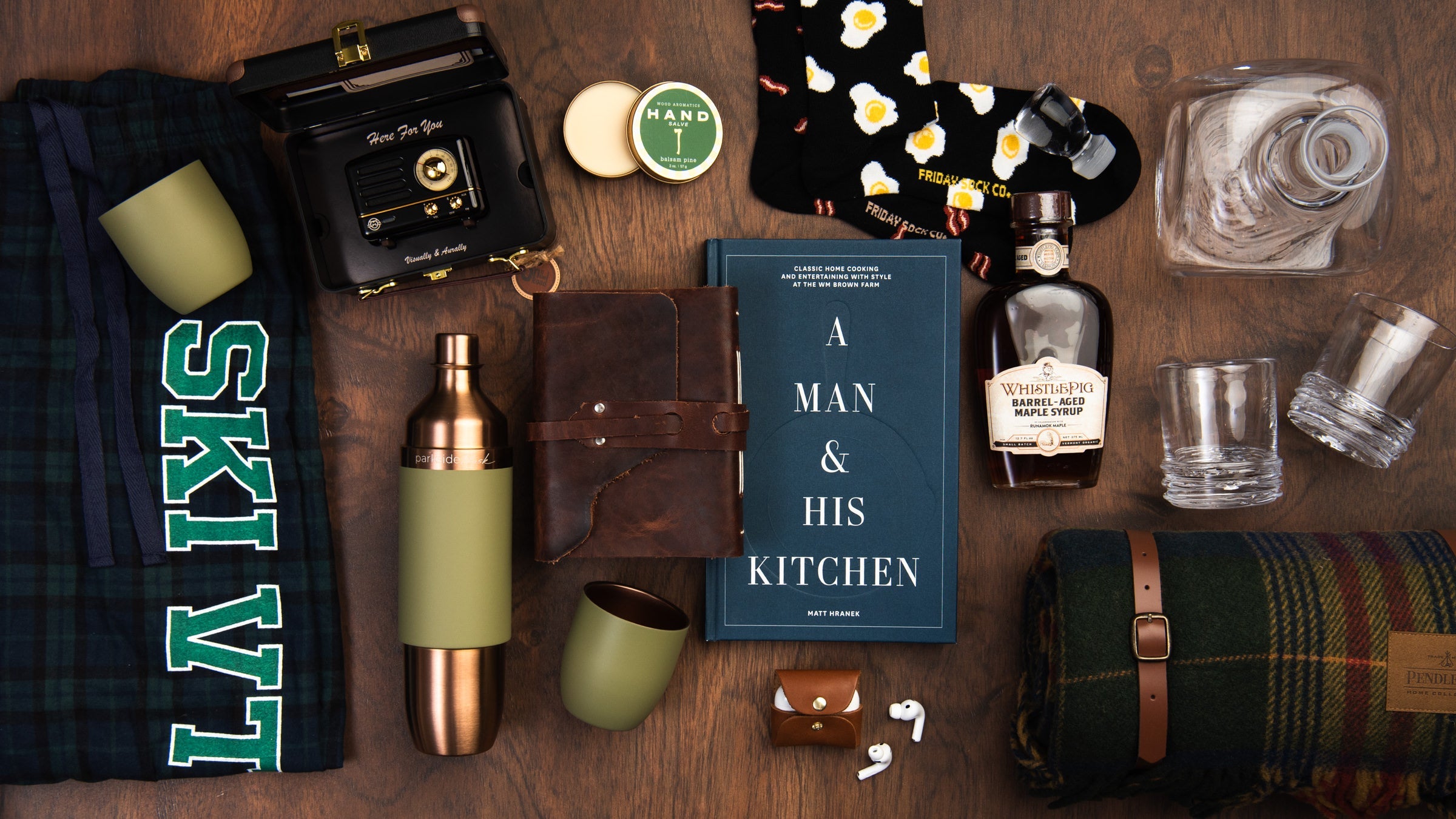 Gifts for men on a wood table at Addison West