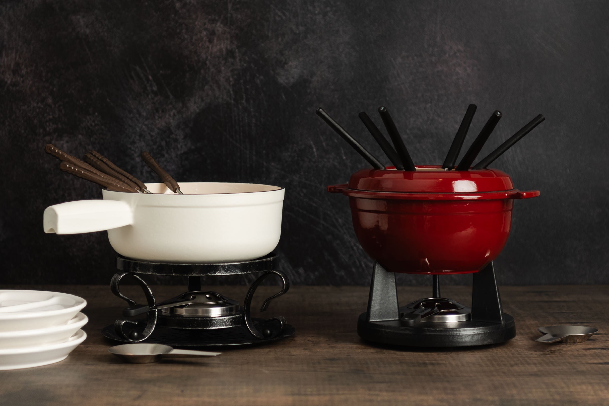 Raclette and fondue sets on a wood table at Addison West