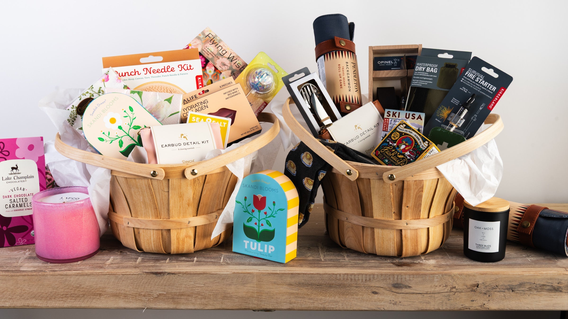 Two easter gift baskets full of unique gifts on a white background at Addison West