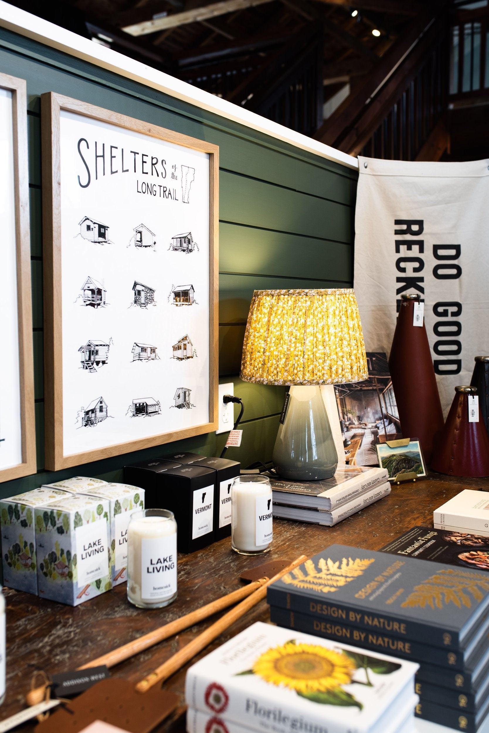 Hand made print wall art on a green wall at Addison West