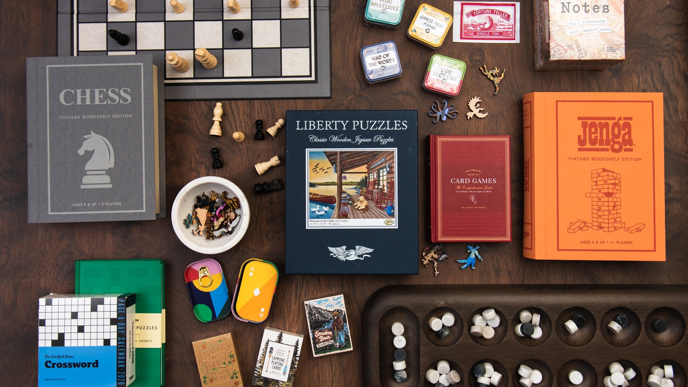 Collection of games and handmade wood puzzles on a wood table at Addison West