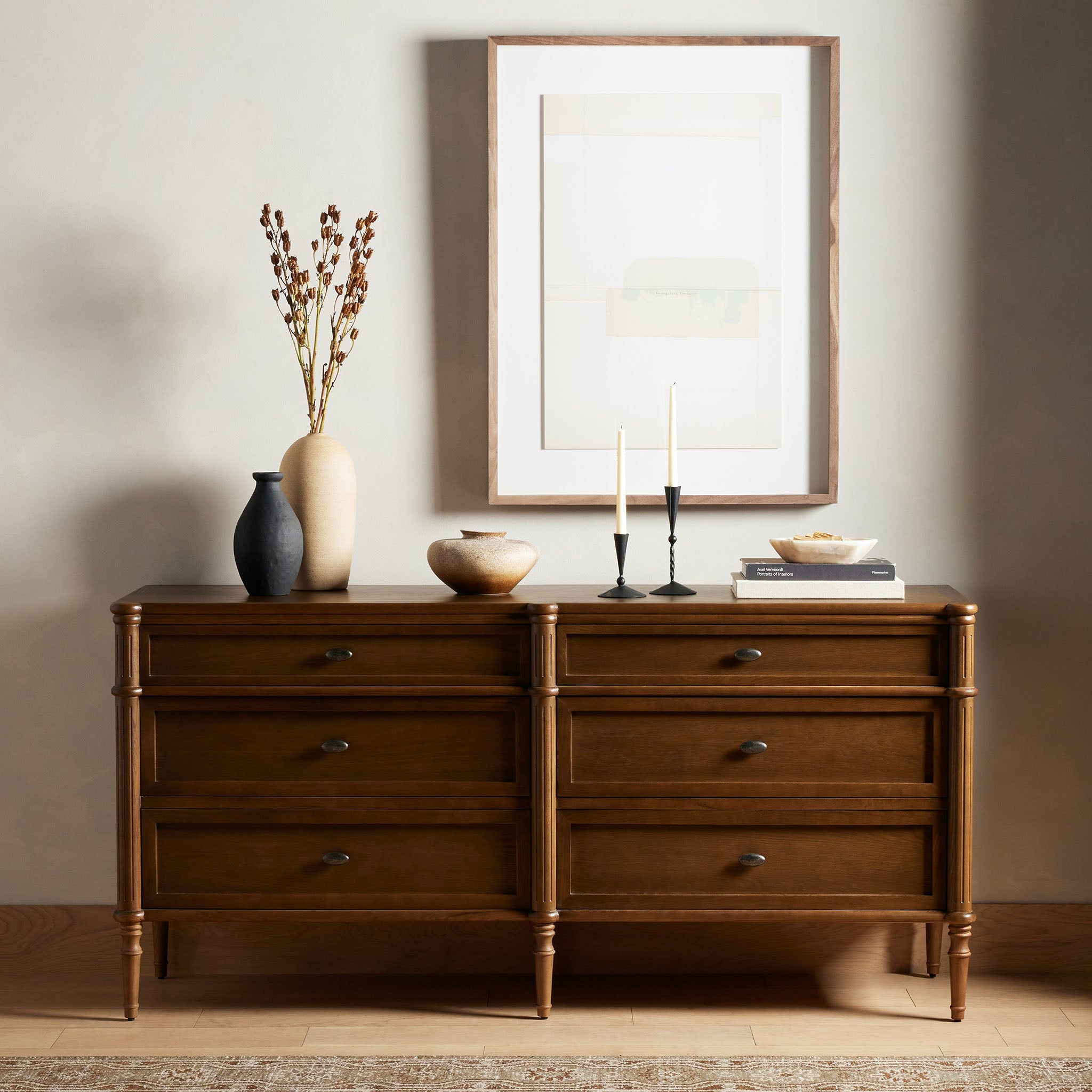 wood dresser in a beige bedroom at Addison West