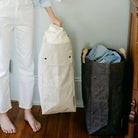 Uashmama Laundry Hamper Bag in a laundry room at Addison West