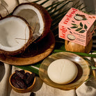Tonka Bean & Coconut Deep Moisturizing Lotion Bar on a table at Addison West