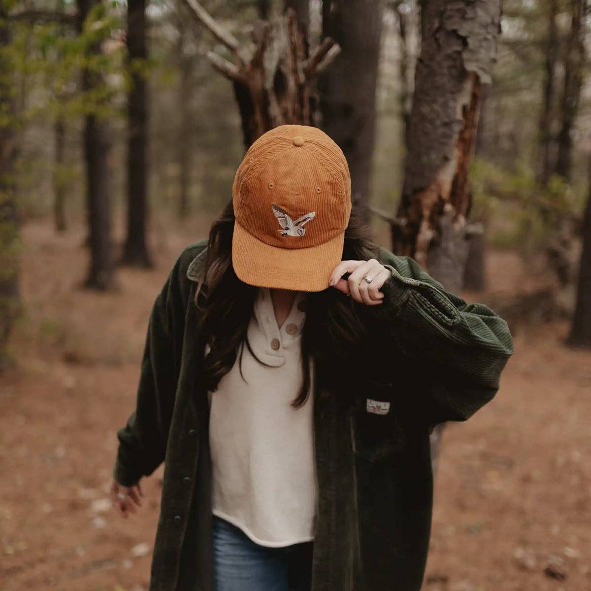 Barn Owl Corduroy Hat in Amber on a model outside at Addison West
