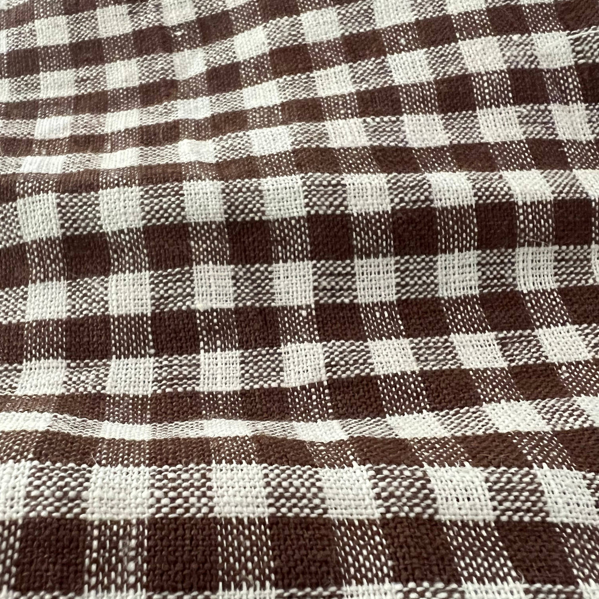 Tobacco Gingham Check Linen Tablecloth, 60" x 90" on a table at Addison West