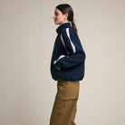 Contrast Trim Sherpa Zip-Up Jacket in Navy on a model at Addison West