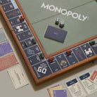 Monopoly Grand Folding Edition on a table  at Addison West