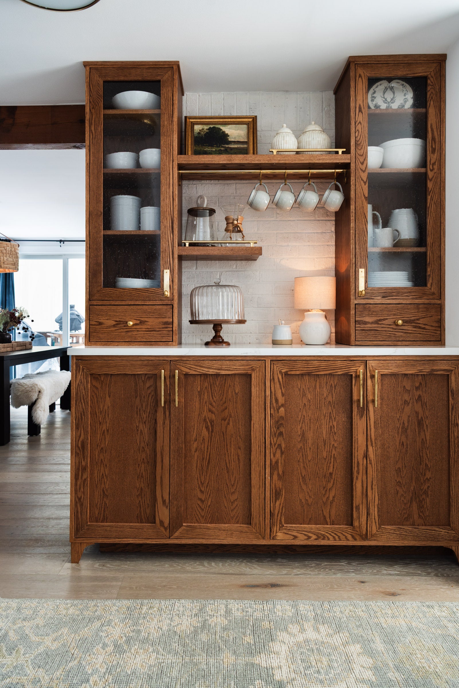 Interior design of a coffee nook with wood cabinets by Addison West