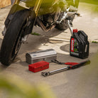 Toyo Steel Stackable Storage Box T-190 in Red on the ground next to a motorcycle at Addison West