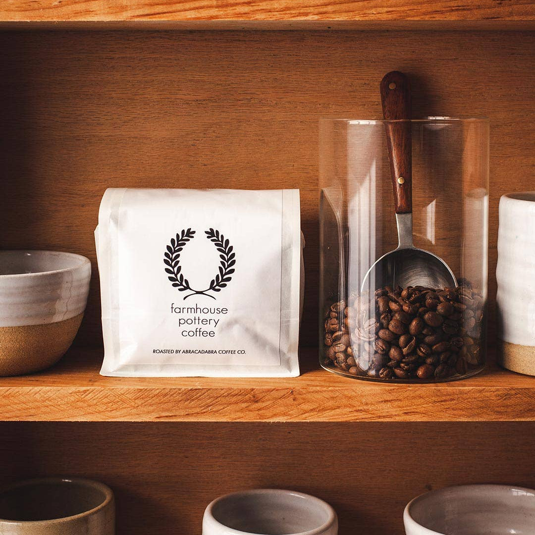 Farmhouse Pottery Artisan Coffee Scoop on a wood shelf at Addison West