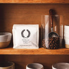 Farmhouse Pottery Artisan Coffee Scoop on a wood shelf at Addison West