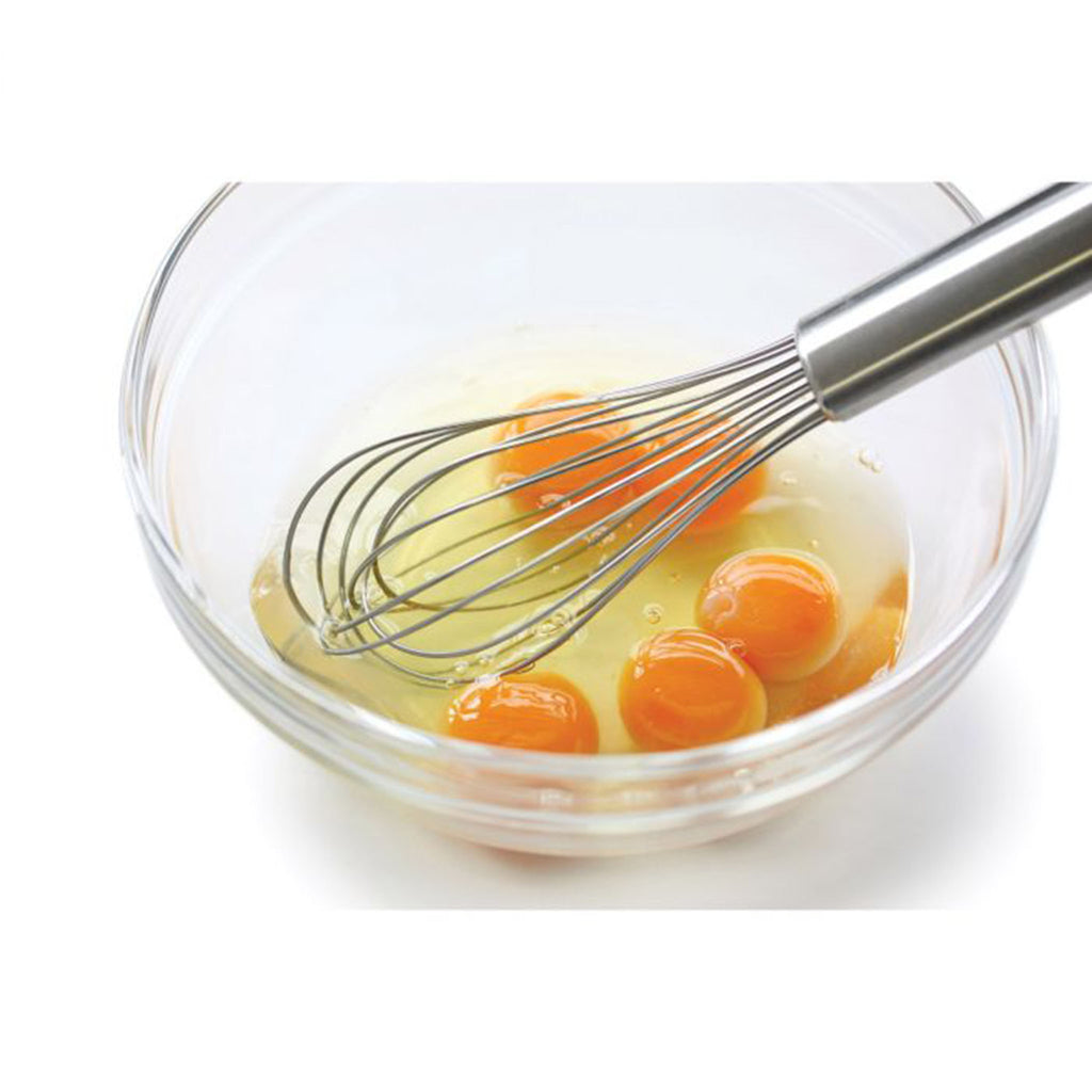 Glass bowl with eggs and 10" Stainless French Whip Whisk on a white background
