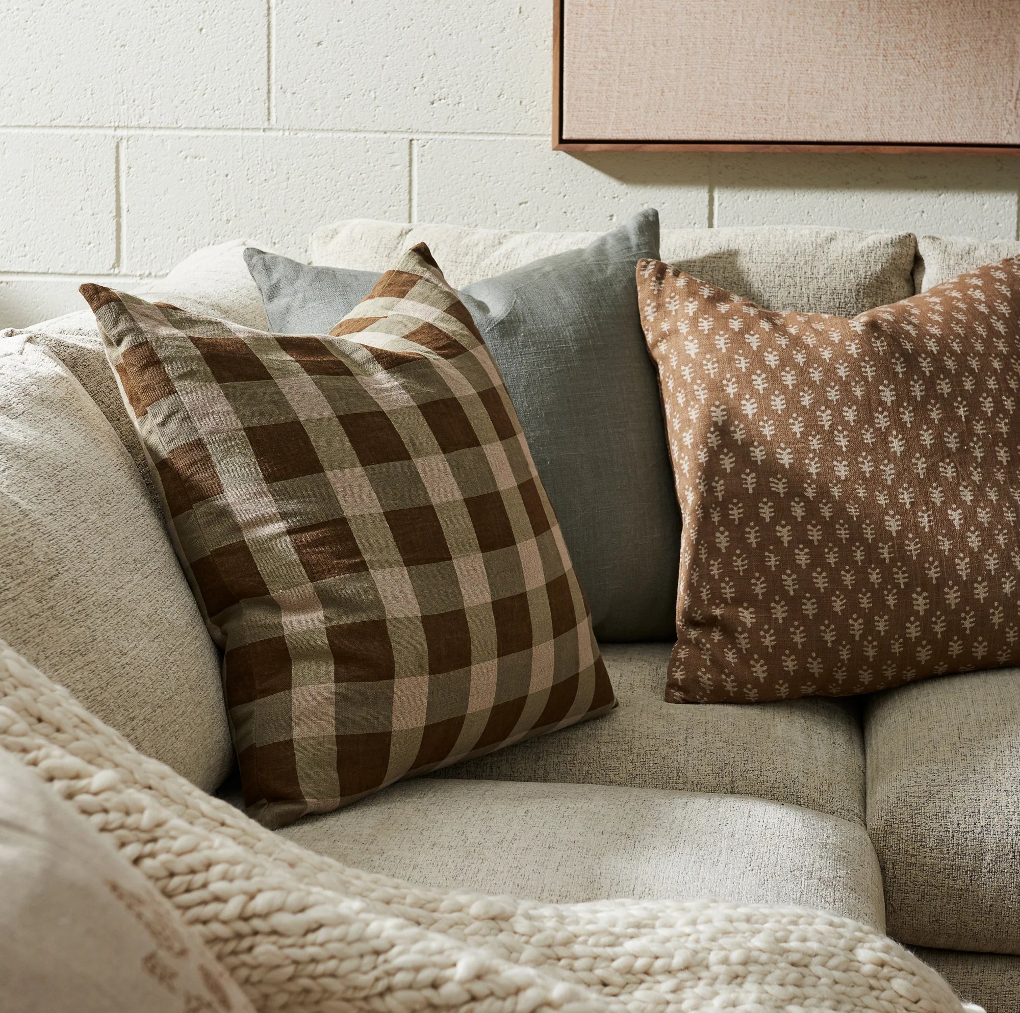 Ezra Mist Pillow 22" on a sofa at Addison West