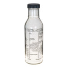 Clear glass bottle with a black cap on a white background