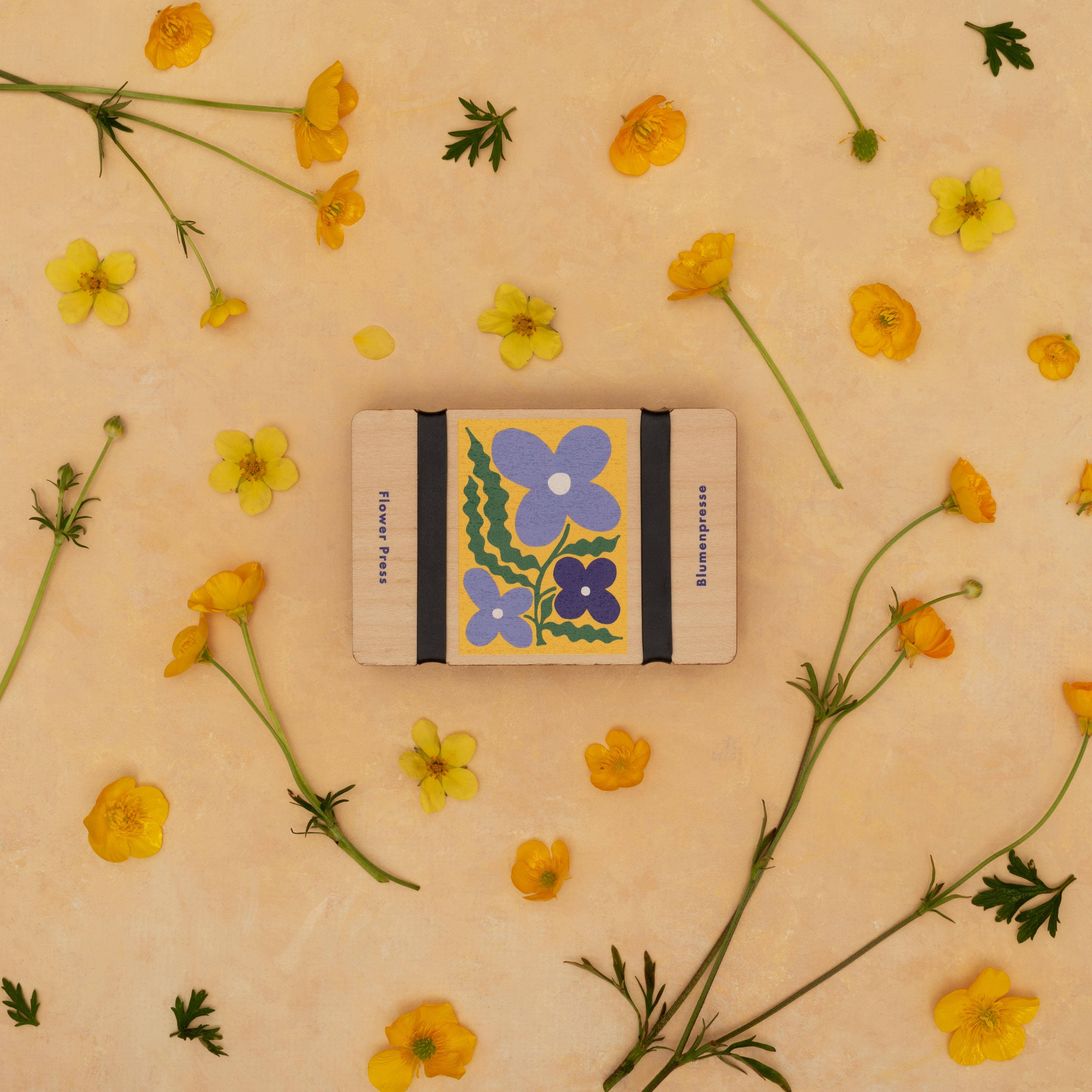 Pocket Flower Press in Smock on a yellow background at Addison West
