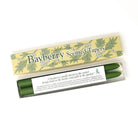 Box of Bayberry Scented Tapers with green candles inside on a white background