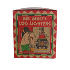Vintage Mr. Mole's Log Lighters box packaging, featuring a red and beige diamond-patterned border and a central illustration of a mole lighting a stove.