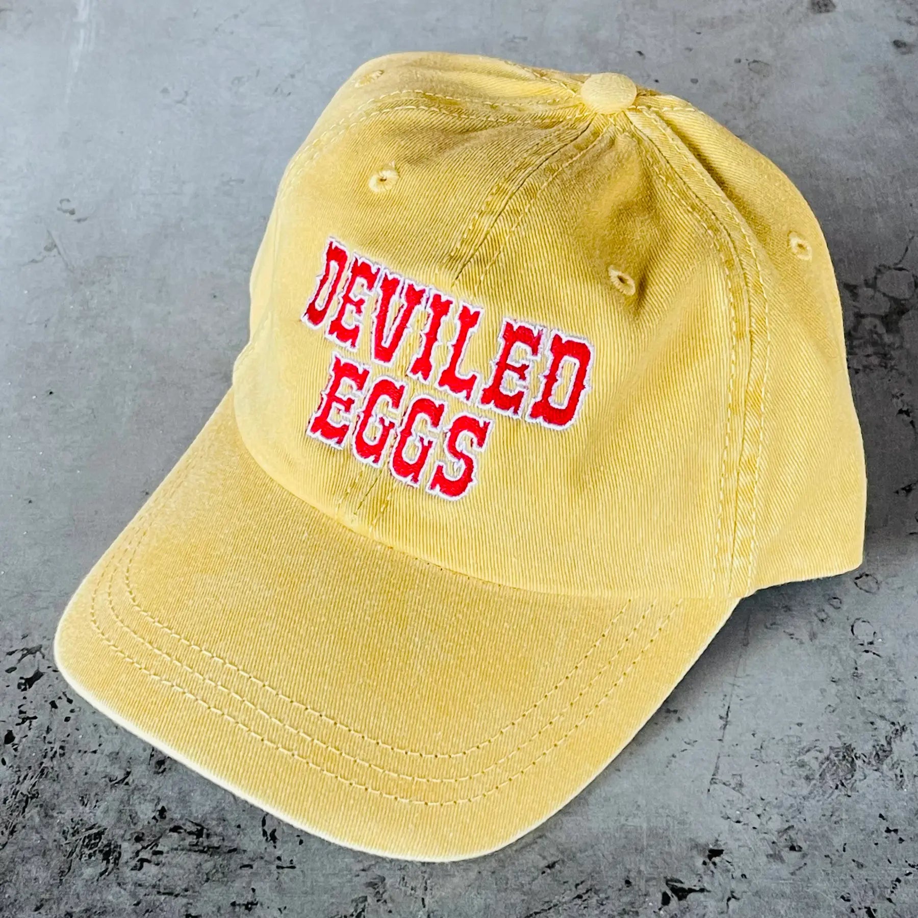 Deviled Eggs Baseball Hat on a grey background at Addison West