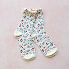 Garden Flower Socks in Ivory on a pink background at Addison West