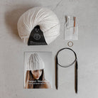 Knitting Craft Kit: Shoreline Beanie in Medium Grey on a beige background at Addison West
