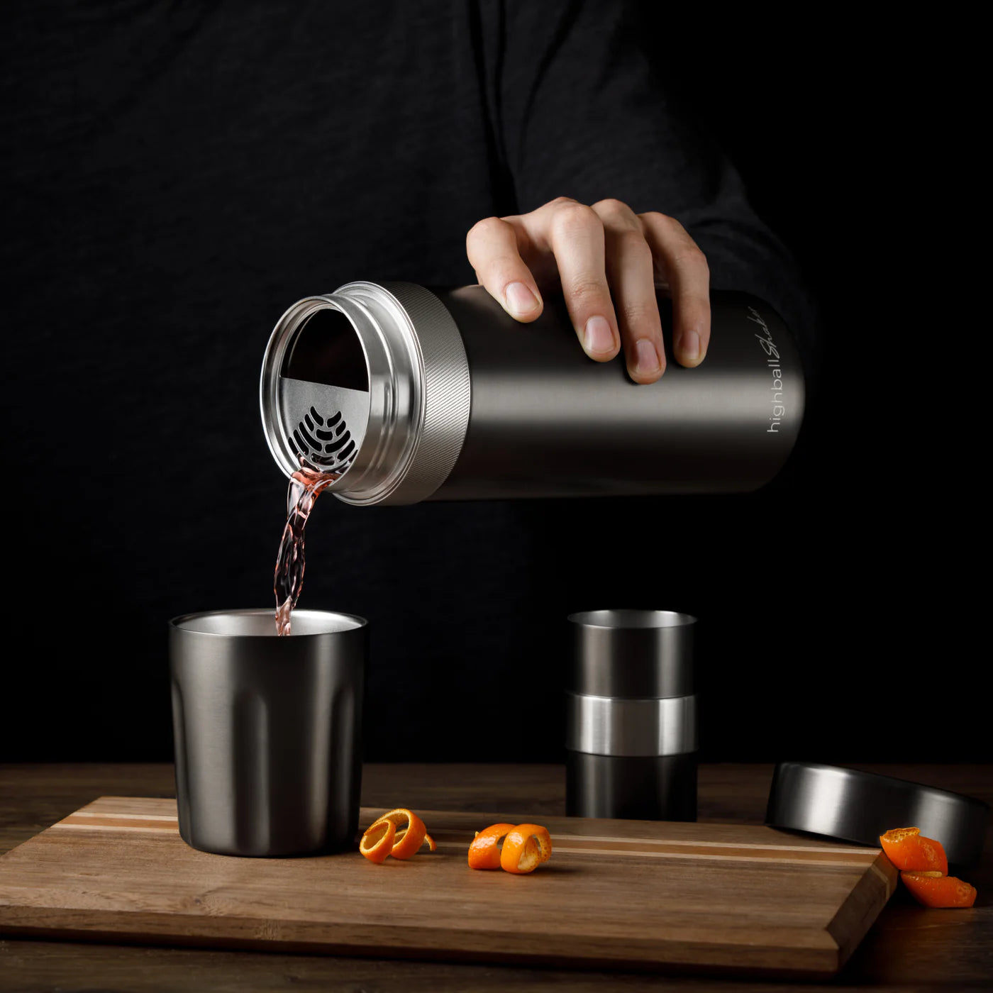 High Camp Highball Shaker in Gunmetal on a table at Addison West
