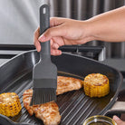Silicone Basting Brush being used by a chef at Addison West