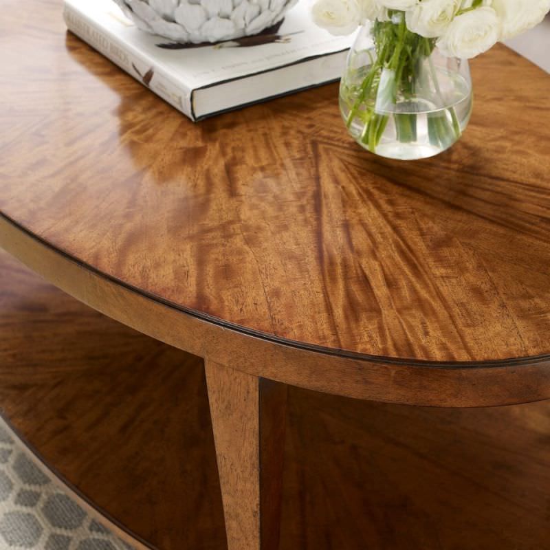 Stafford Oval Cocktail Table in Hazelnut Finish in a bedroom at Addison West