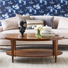 Stafford Oval Cocktail Table in Hazelnut Finish in a living room at Addison West