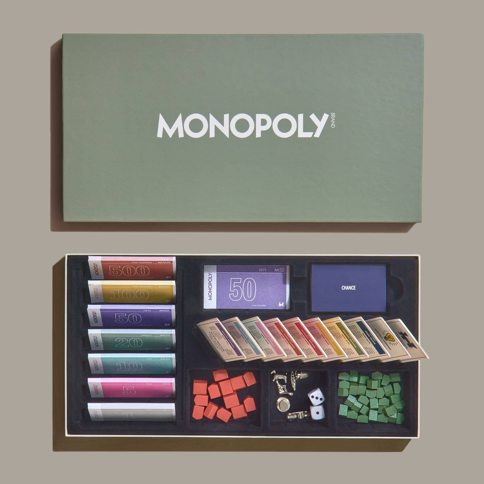 Monopoly Grand Folding Edition on a green background at Addison West