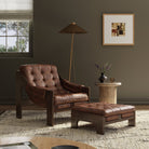 Four Hands Halston Chair & Ottoman in Heirloom Sienna in a green living room at Addison West