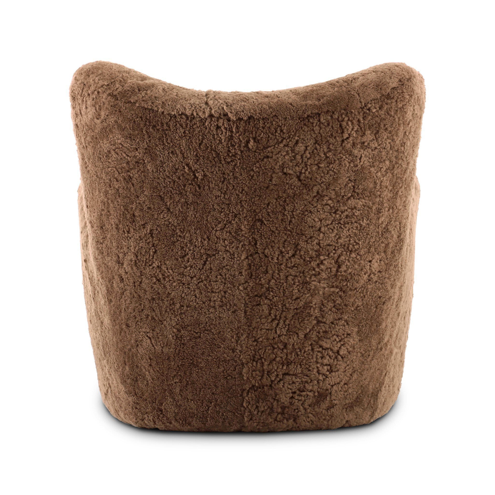 Four Hands Amelie Chair in Amber Shearling on a white background at Addison West 