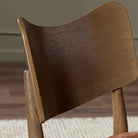Close up of Four Hands Marley Dining Chair in Altair Sienna in a dining room at Addison West