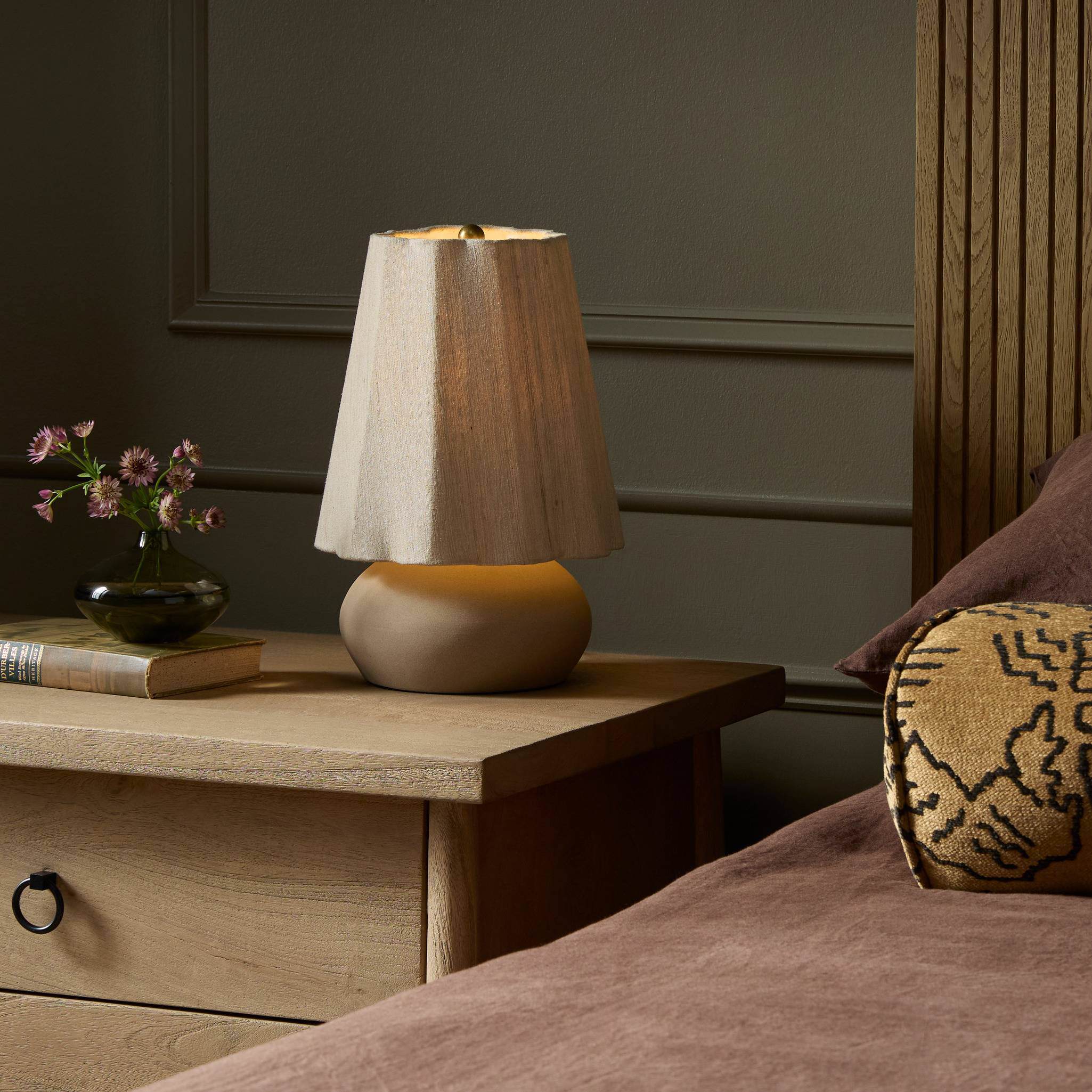 Four Hands Posie Table Lamp in Tan Speckled Ceramic on a nightstand at Addison West